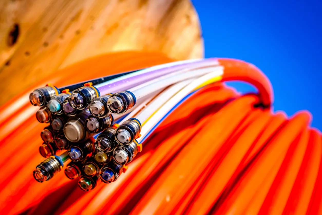 Spools of fiber optic cable staged for a broadband build