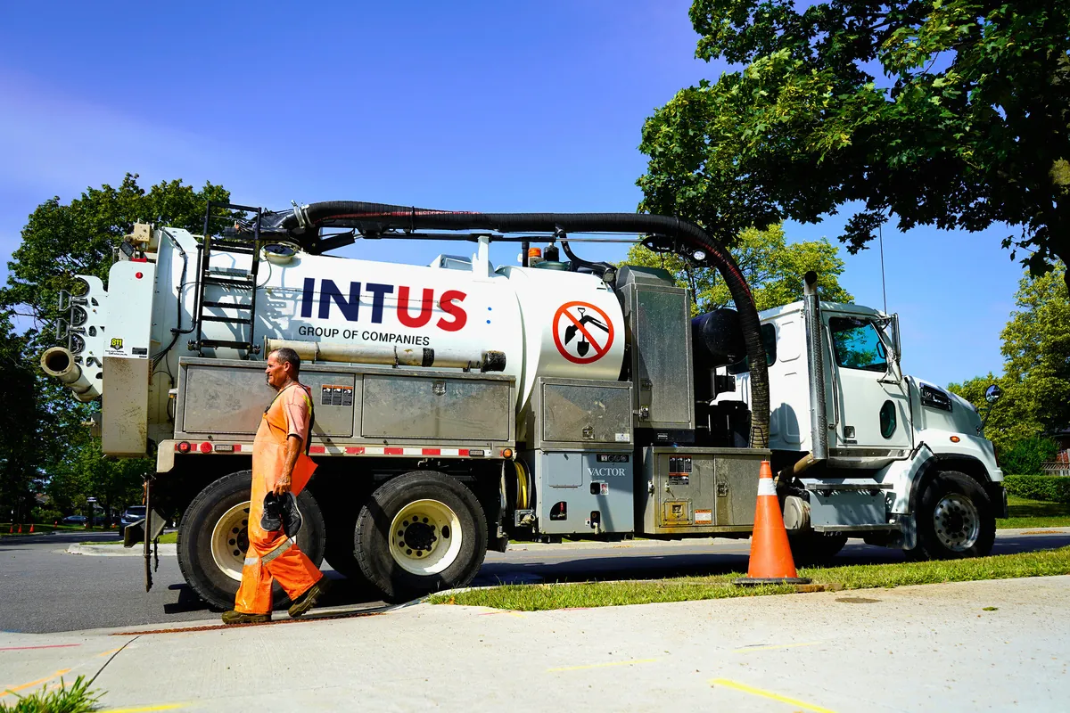 A hydrovac vacuum excavation truck on a utility work site