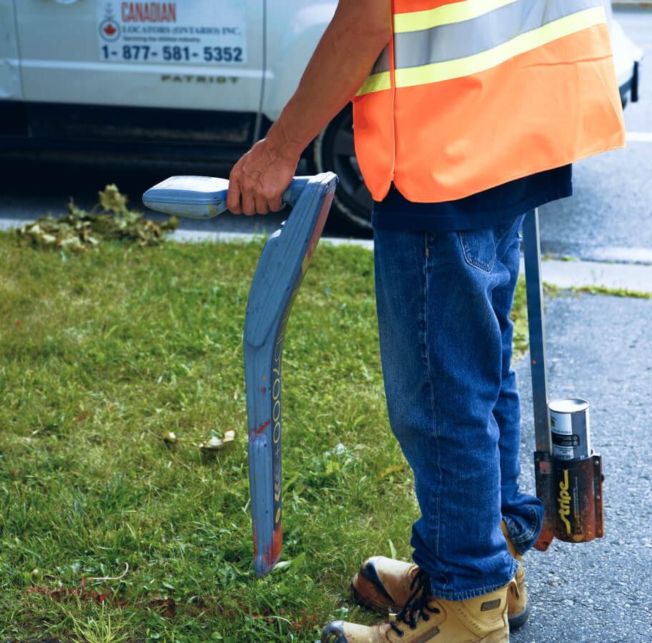 A CUTI-trained utility locator working in the field with locating equipment